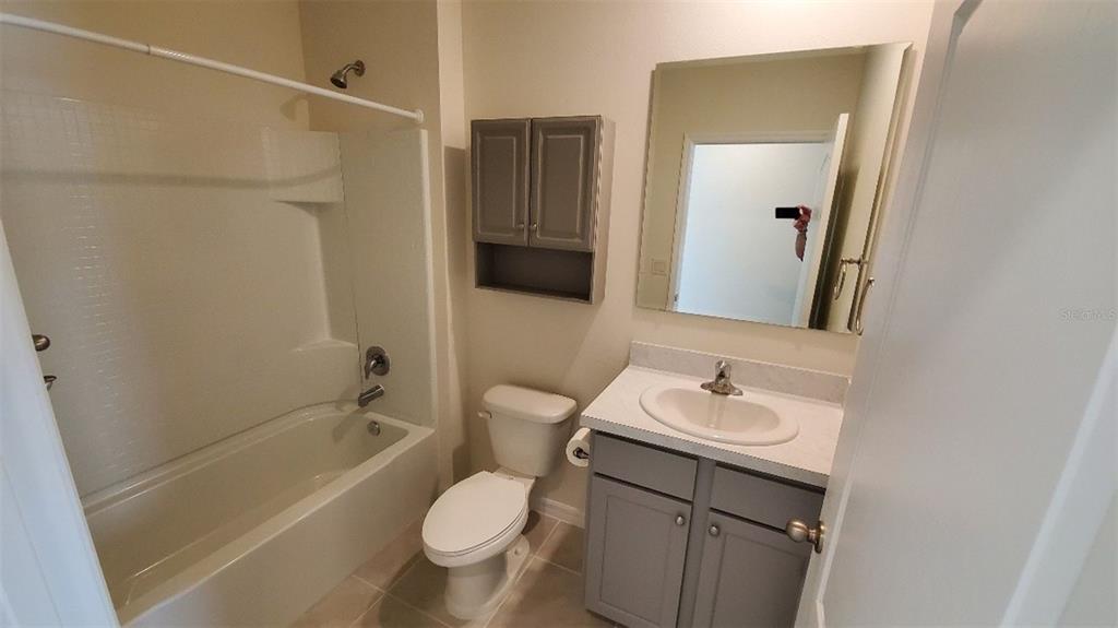 140 Old Mill Edgewater, FL 32141 - Photo 10 of 12 a bathroom with a sink toilet and shower