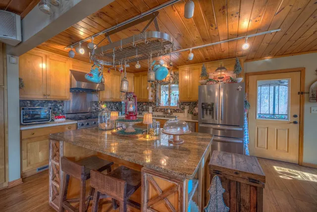 a living room with lots of furniture and wooden floor