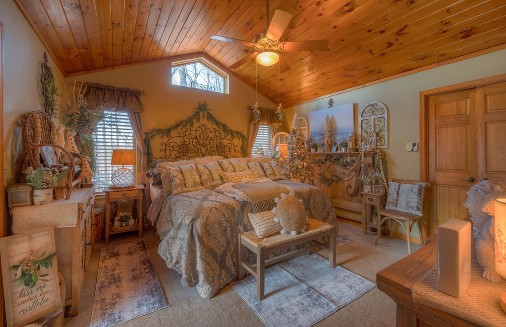 2875 Hickory Cove Murphy, NC 28906 - Photo 23 of 87 a bed sitting in a bedroom next to a window