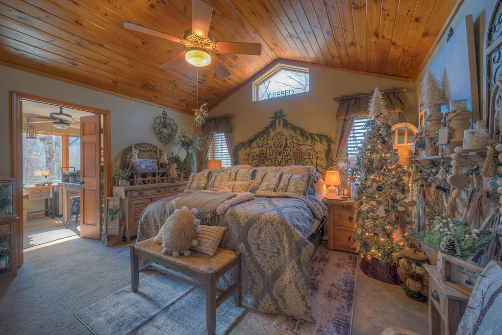 2875 Hickory Cove Murphy, NC 28906 - Photo 26 of 87 a bedroom with a bed and a chandelier
