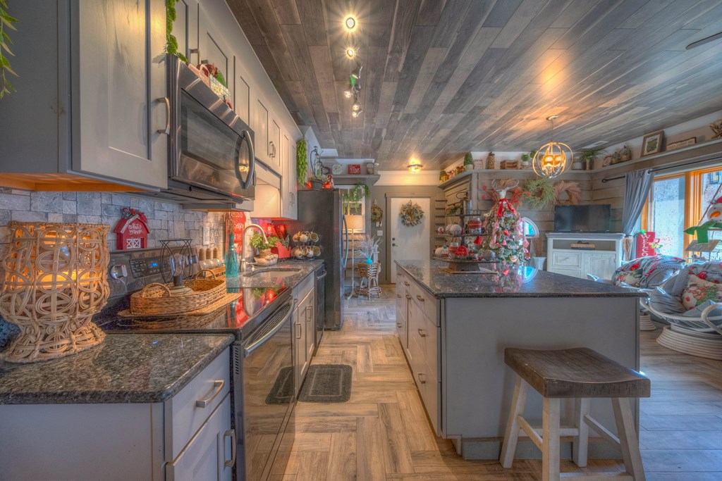2875 Hickory Cove Murphy, NC 28906 - Photo 35 of 87 a kitchen with stainless steel appliances granite countertop a sink and cabinets