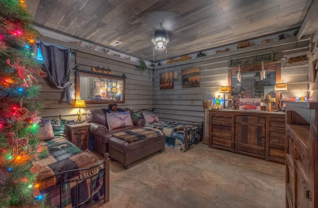 a living room with furniture and a floor to ceiling window