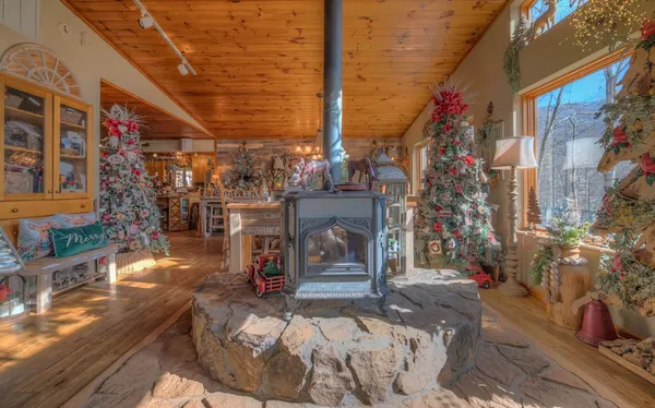 a kitchen with stainless steel appliances granite countertop a stove and cabinets
