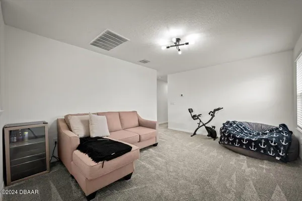 a living room with furniture and a couch