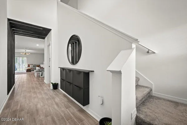 a view of a hallway view with staircase