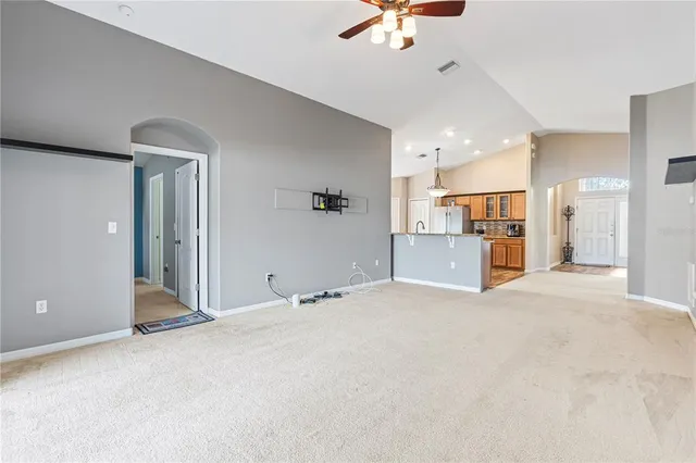 a view of a livingroom with a kitchen