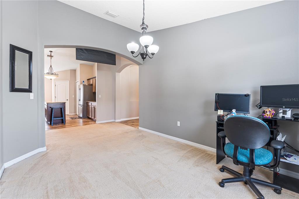 4667 Hickory Stream Lane Mulberry, FL 33860 - Photo 17 of 41 a view of a livingroom with a workspace