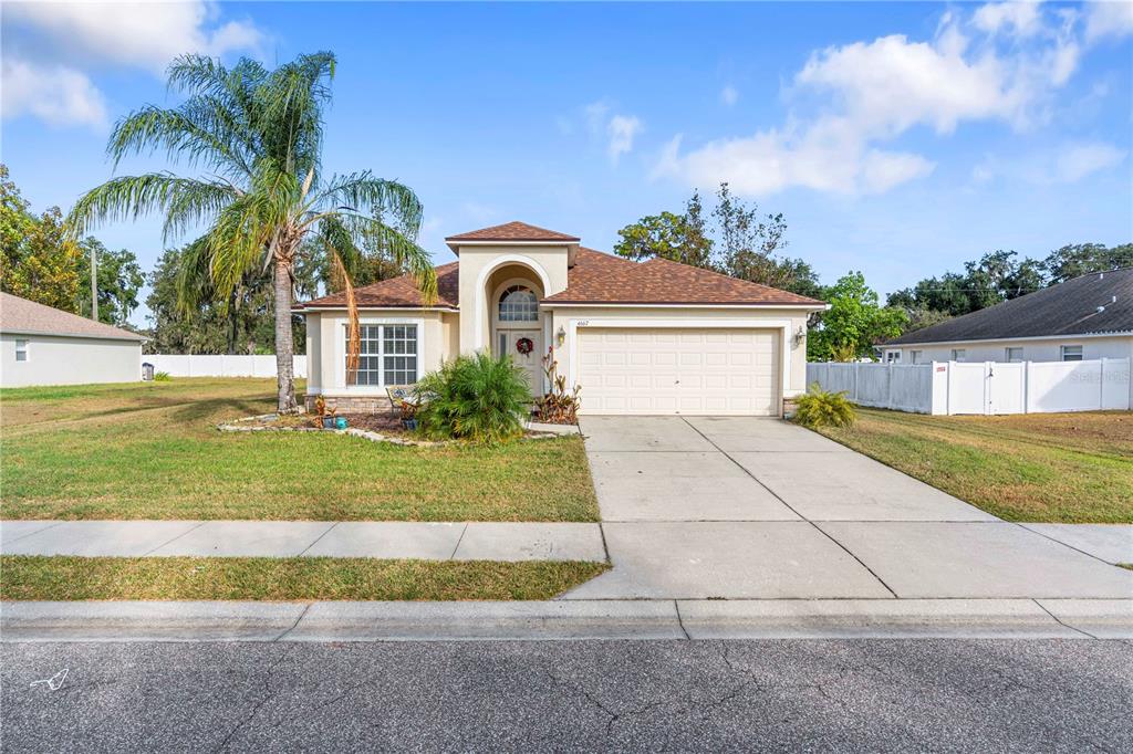4667 Hickory Stream Lane Mulberry, FL 33860 - Photo 2 of 41 a front view of house with yard and green space