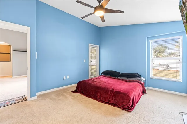 a bedroom with a bed and window