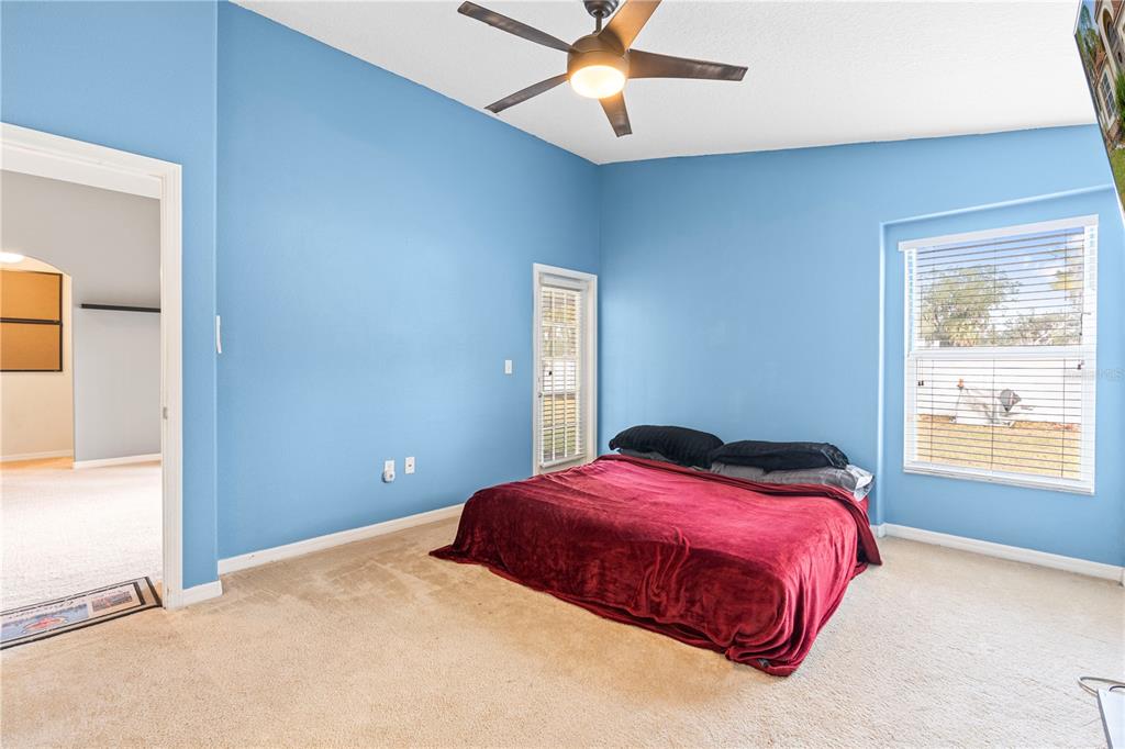 4667 Hickory Stream Lane Mulberry, FL 33860 - Photo 21 of 41 a bedroom with a bed and window