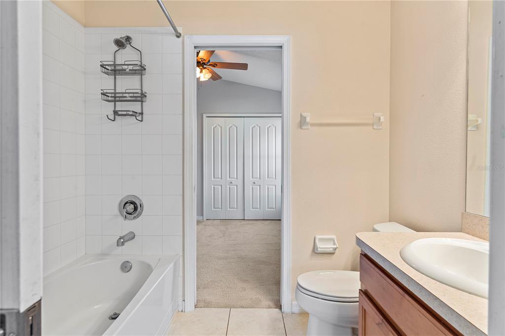 4667 Hickory Stream Lane Mulberry, FL 33860 - Photo 26 of 41 a bathroom with a sink a toilet and shower