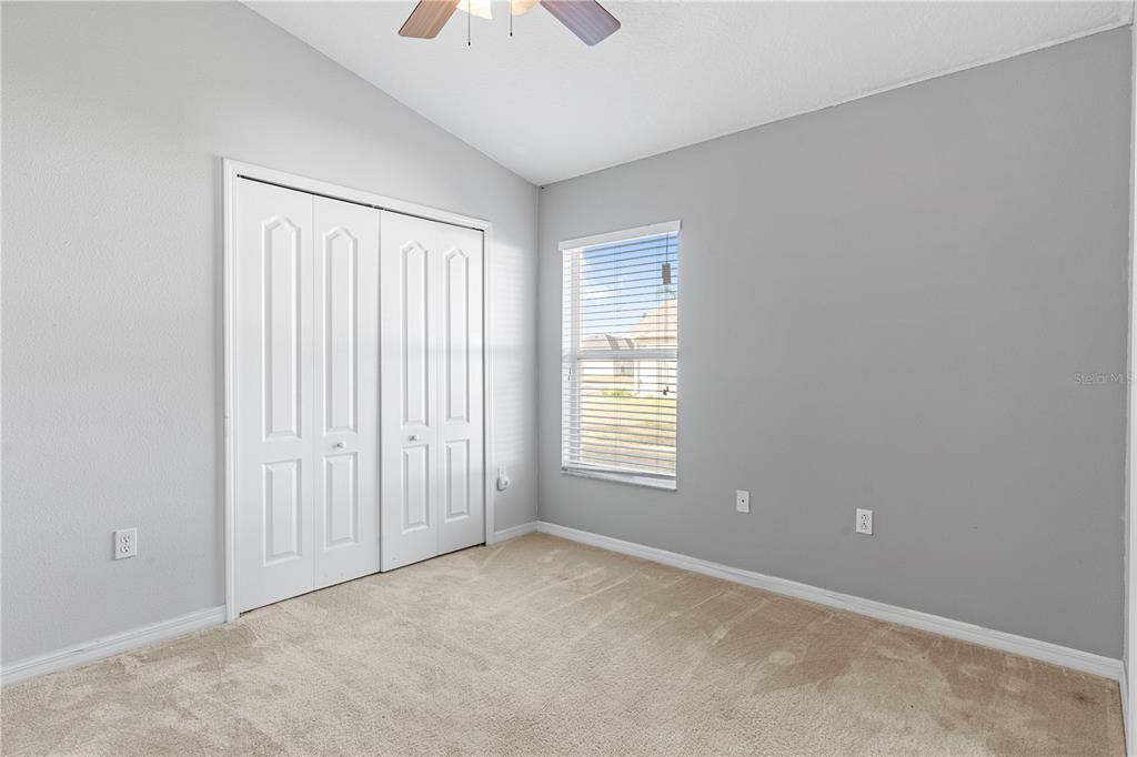 4667 Hickory Stream Lane Mulberry, FL 33860 - Photo 27 of 41 an empty room with windows