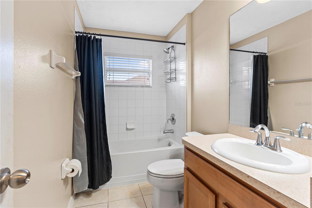 4667 Hickory Stream Lane Mulberry, FL 33860 - Photo 33 of 41 a bathroom with a sink toilet and shower