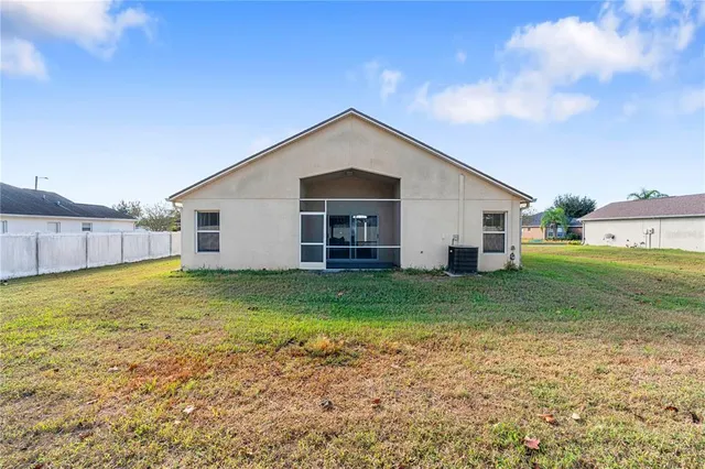 a view of a backyard with large trees