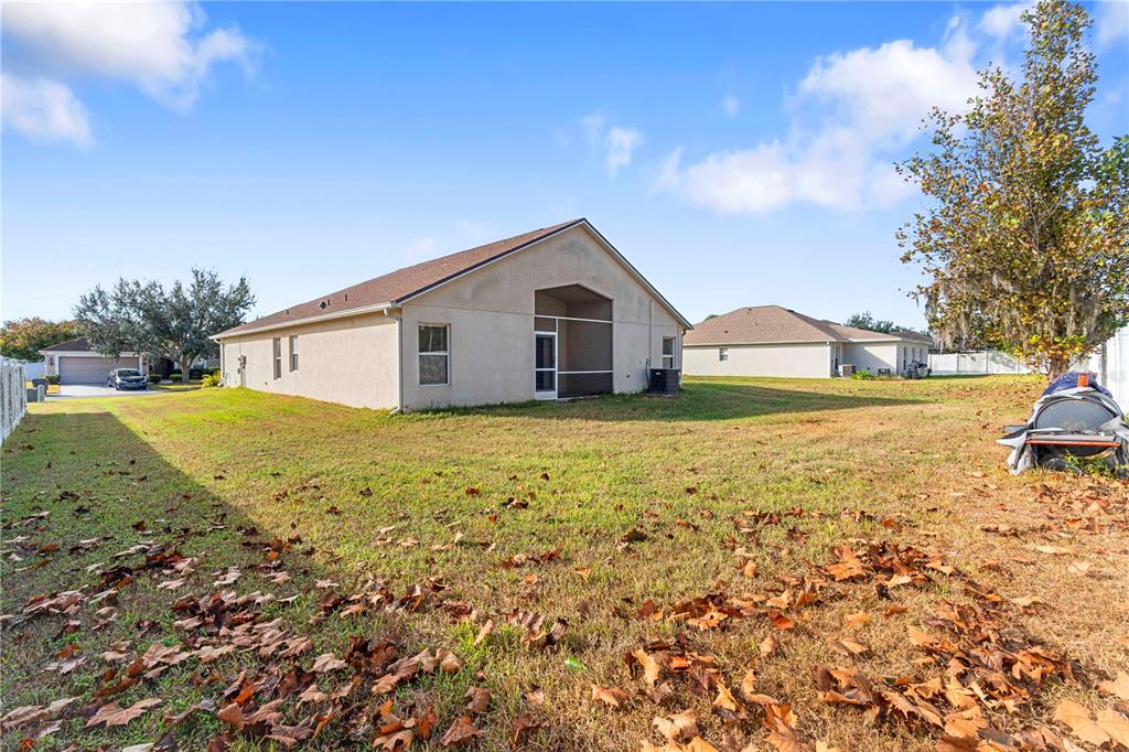 4667 Hickory Stream Lane Mulberry, FL 33860 - Photo 40 of 41 a view of a house with a yard