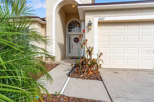 a front view of a house with outdoor seating