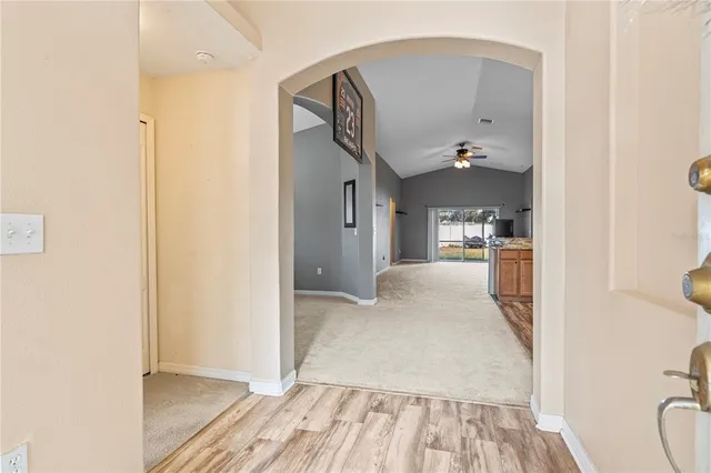 a view of a kitchen from the hallway