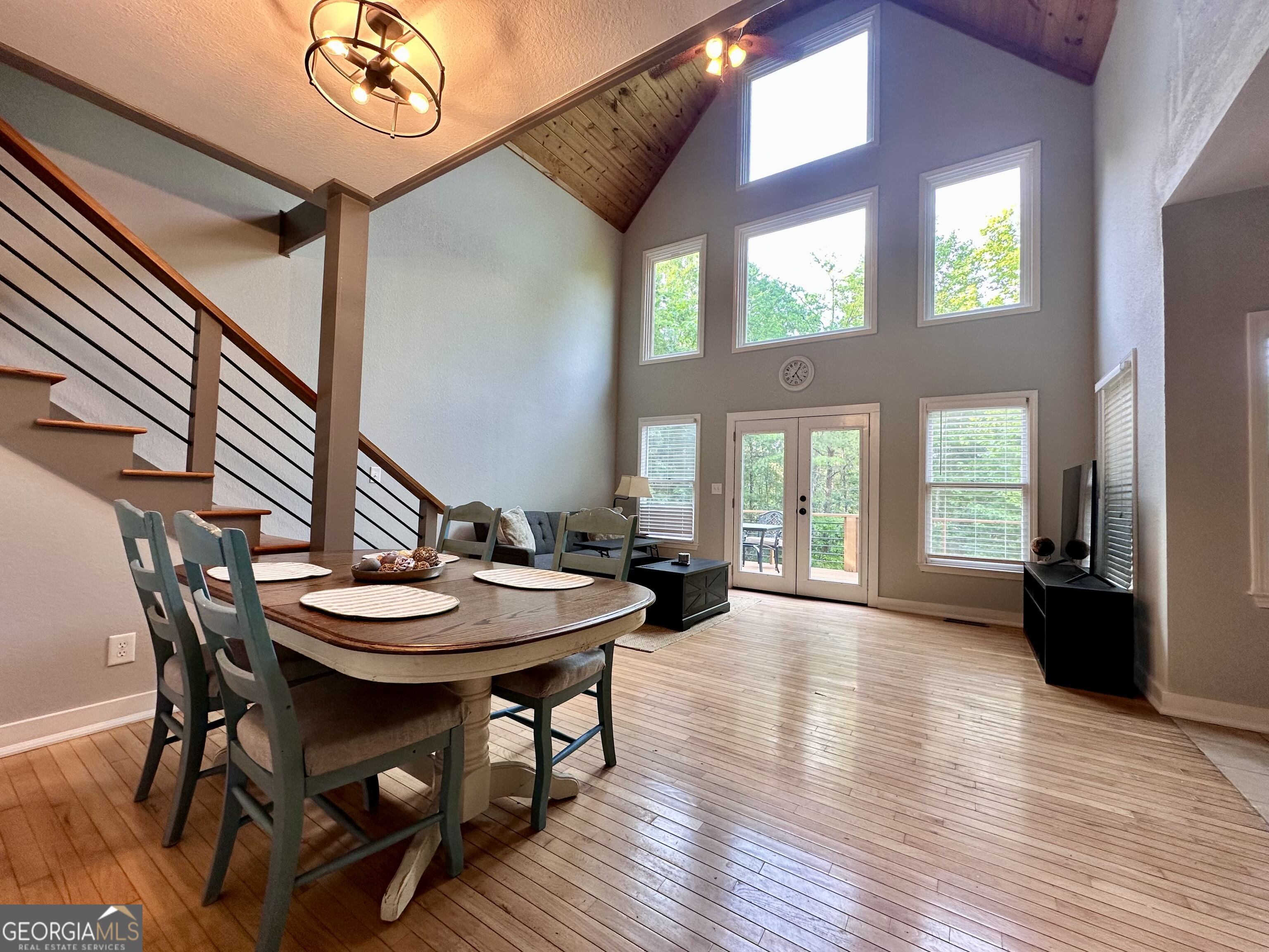 2769 Bean Creek Road Sautee Nacoochee, GA 30571 - Photo 5 of 33 a view of a dining room with furniture window and wooden floor