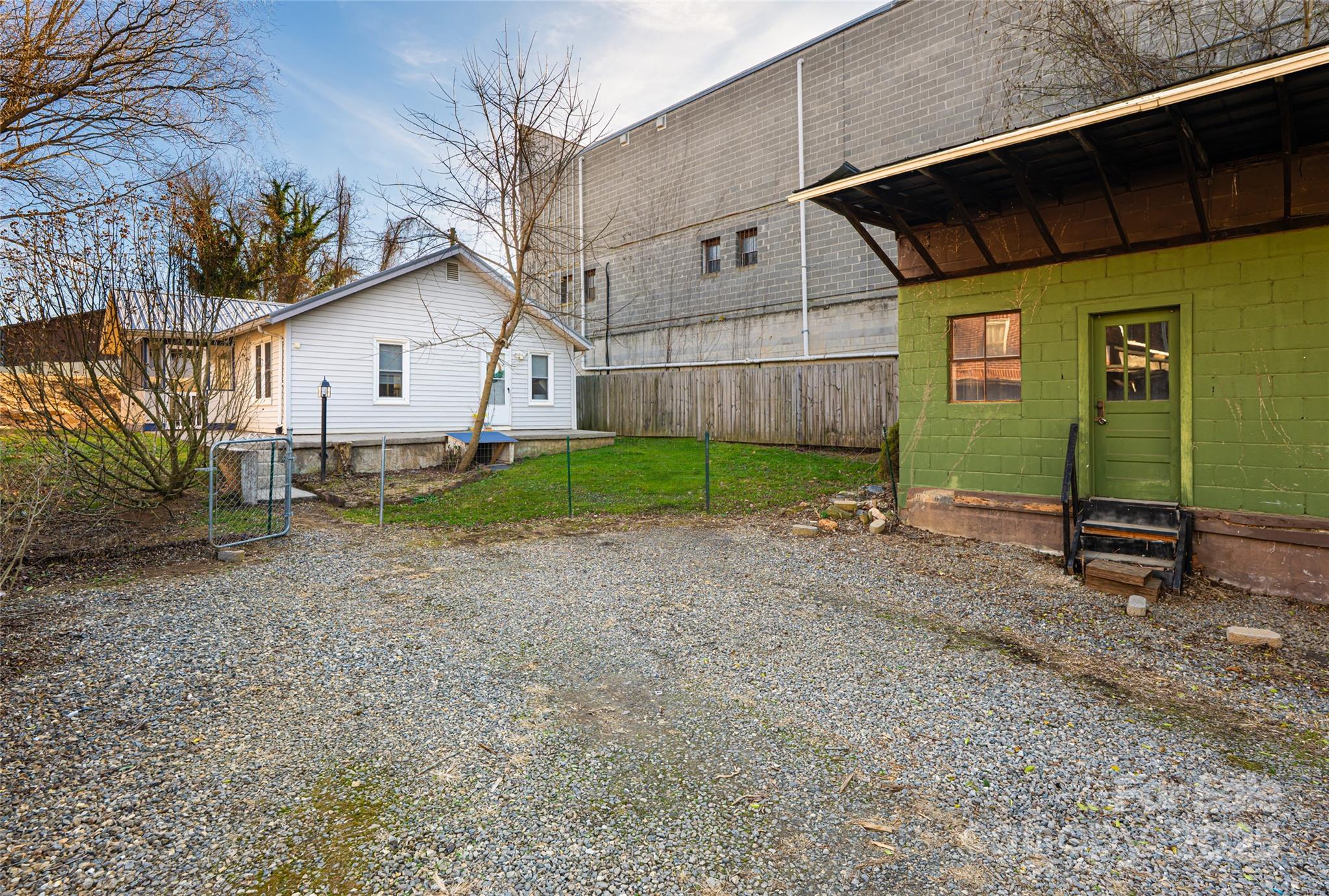 714.5 Reed Street Asheville, NC 28803 - Photo 2 of 26 a view of a house with a small yard and a large tree