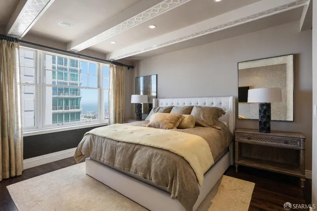 a bedroom with a large bed and a window