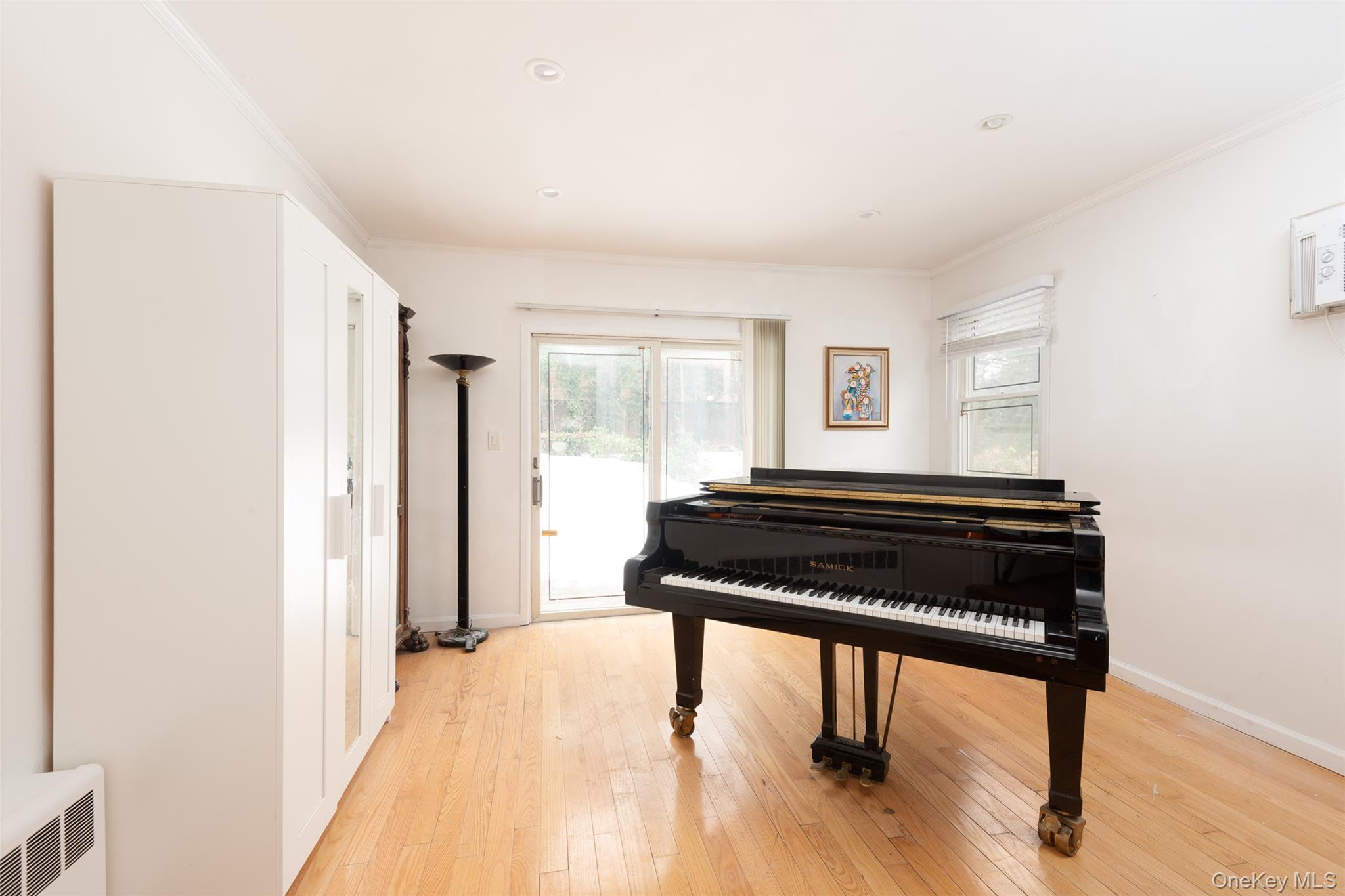 200 Melbourne Road Great Neck, NY 11021 - Photo 11 of 24 a bedroom with a bed and a window