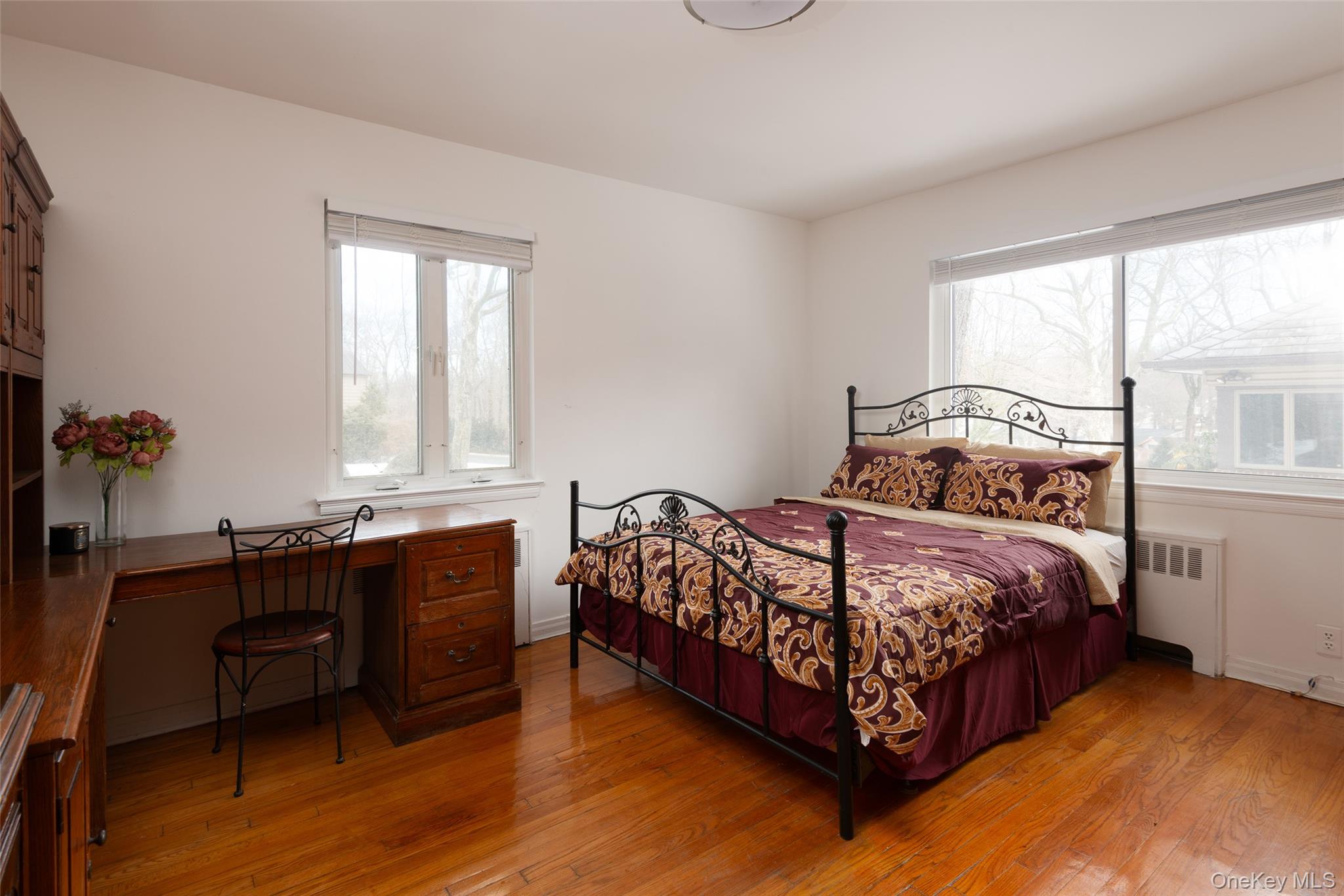 200 Melbourne Road Great Neck, NY 11021 - Photo 14 of 24 a bedroom with a bed and window