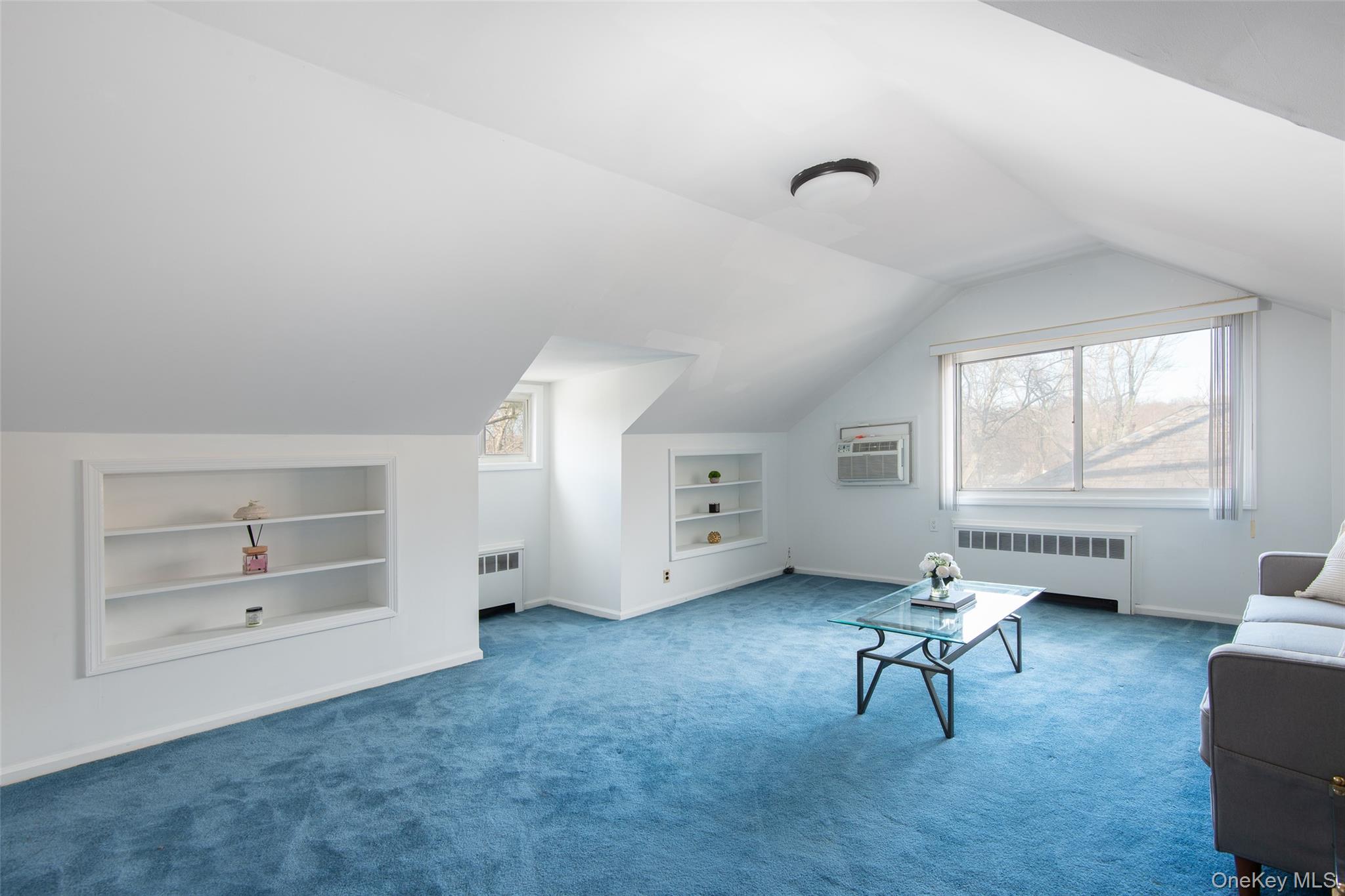200 Melbourne Road Great Neck, NY 11021 - Photo 18 of 24 a living room with furniture and a window