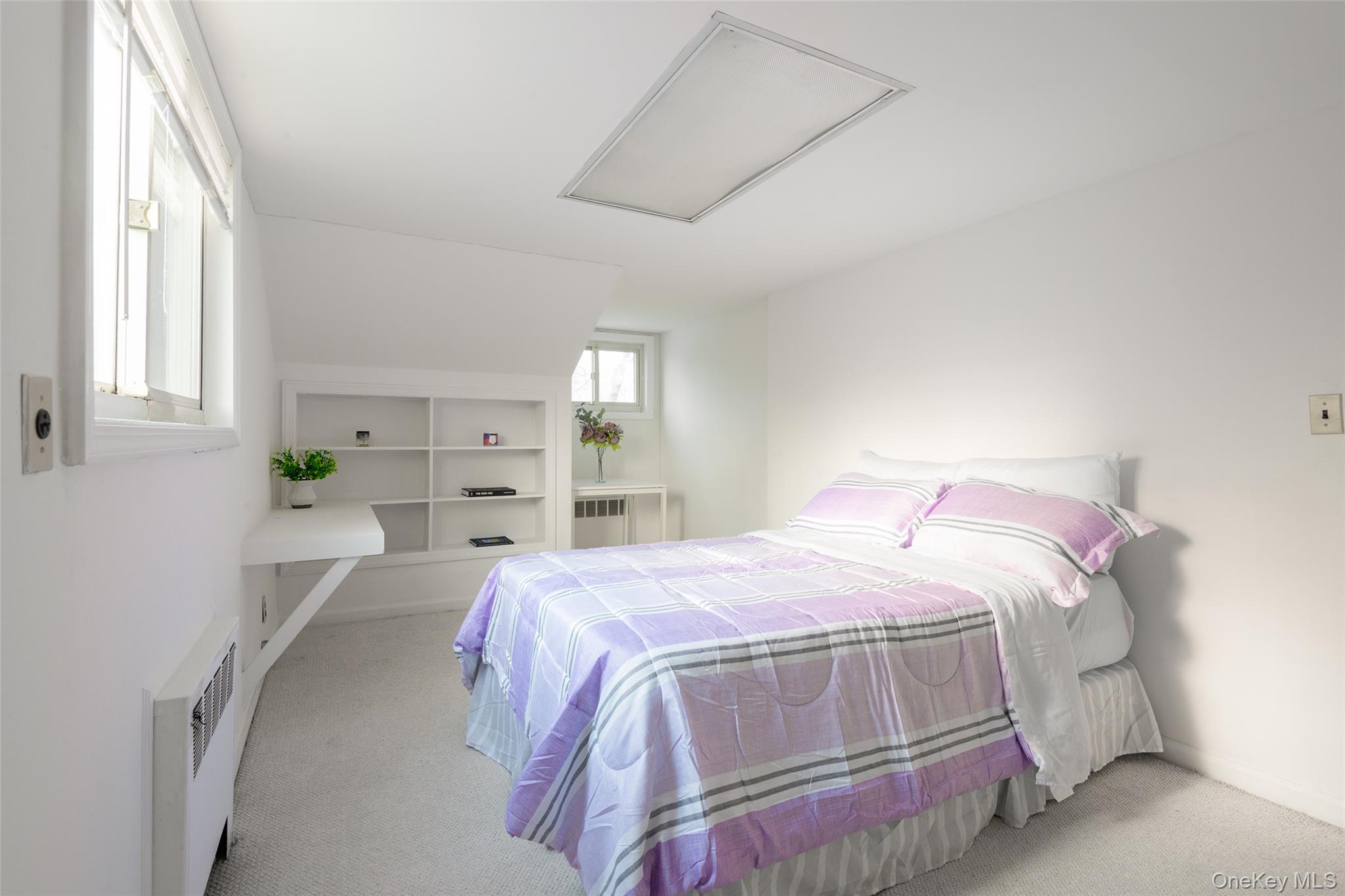 200 Melbourne Road Great Neck, NY 11021 - Photo 21 of 24 a bedroom with a bed and a window