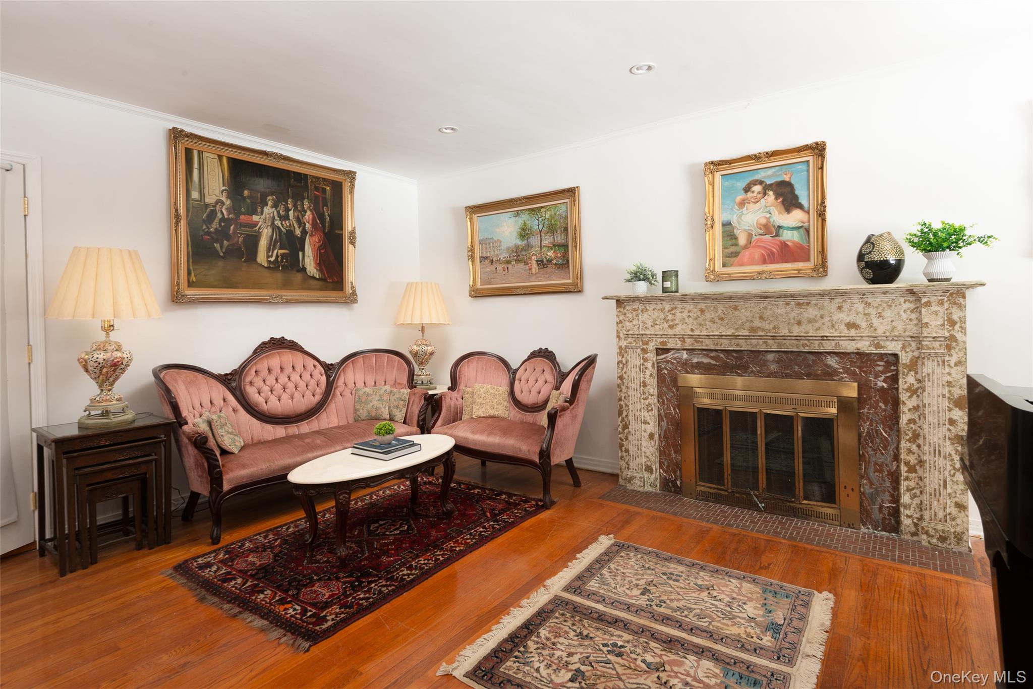 200 Melbourne Road Great Neck, NY 11021 - Photo 5 of 24 a living room with furniture and a fireplace