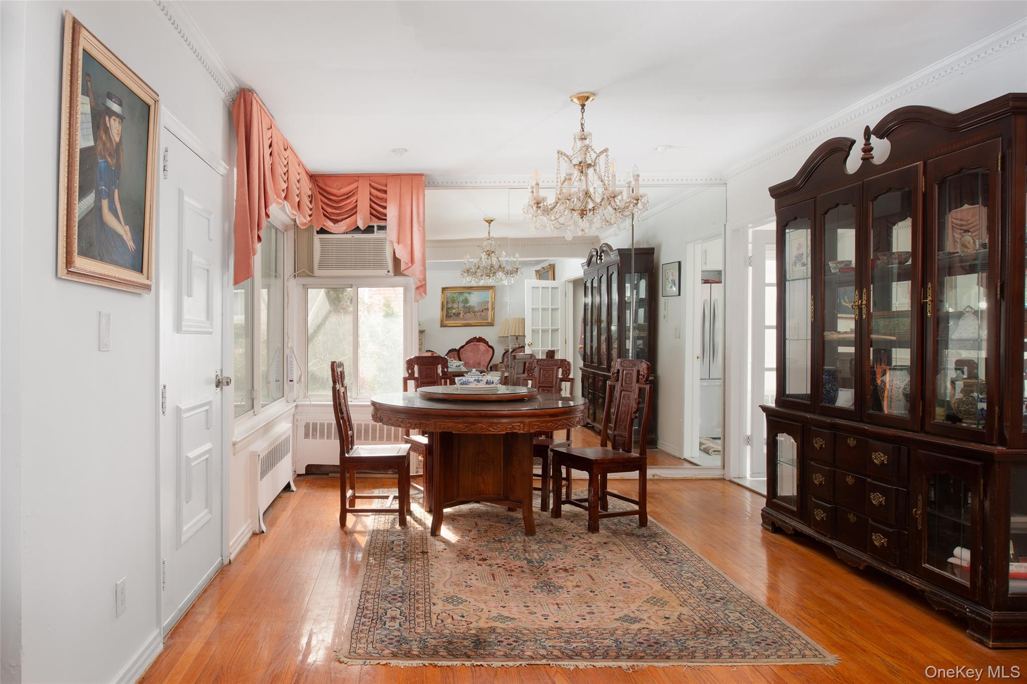 200 Melbourne Road Great Neck, NY 11021 - Photo 6 of 24 a view of a dining room with furniture and chandelier
