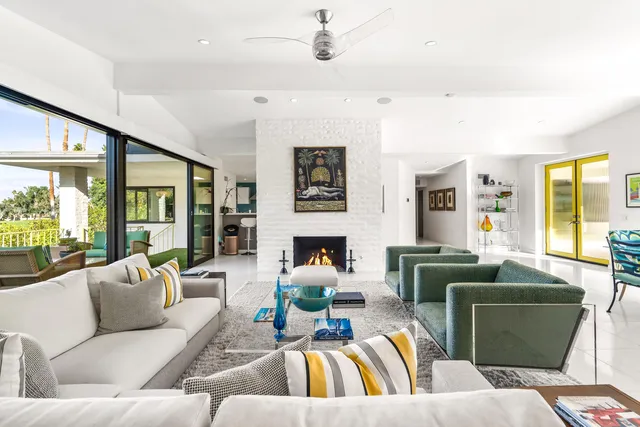 a view of a chair and tables in the back yard