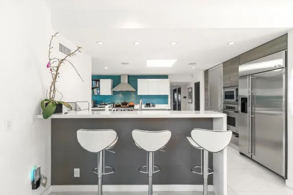 a bathroom with a sink vanity and a mirror