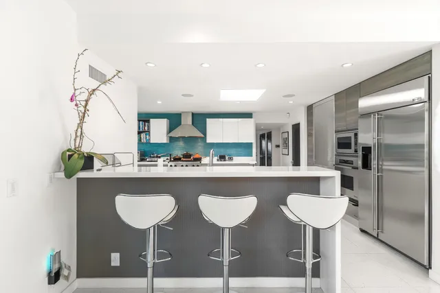 a bathroom with a sink vanity and a mirror