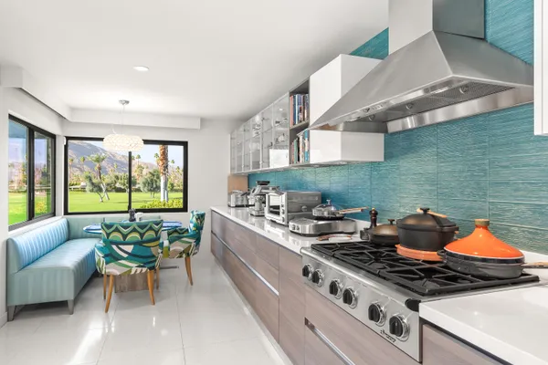 a bathroom with a granite countertop sink a bathtub and with shower