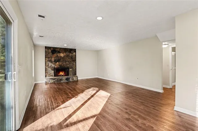 a room with a bed and a flat screen tv