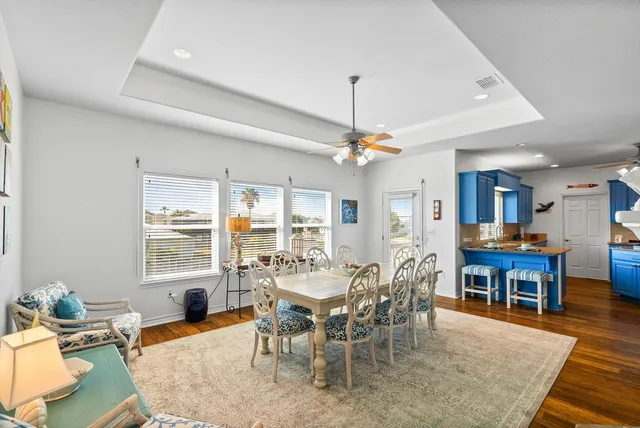 a kitchen with granite countertop a sink cabinets and stainless steel appliances