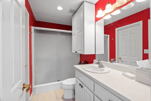 a bed room with a bed and a window