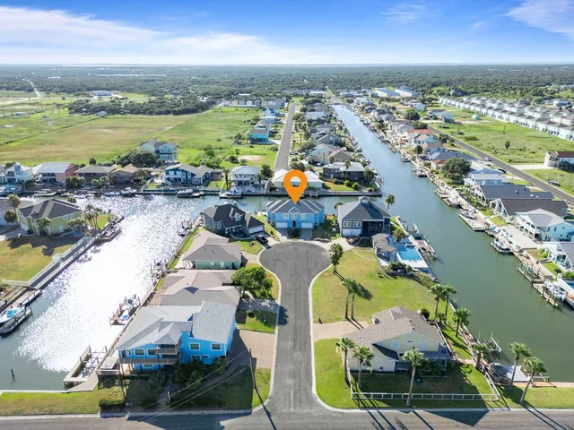 a dining room with furniture a chandelier and window