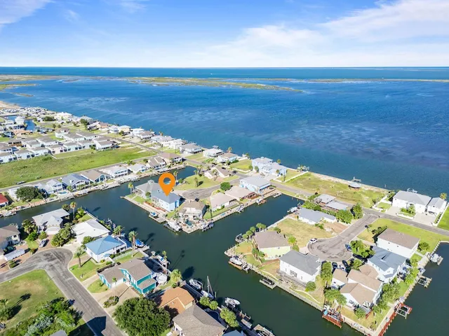 an aerial view of a city with ocean view