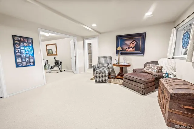 a spacious bathroom with a sink and a mirror