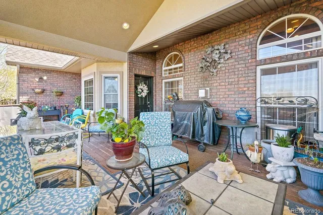 a dining room with furniture a rug and wooden floor