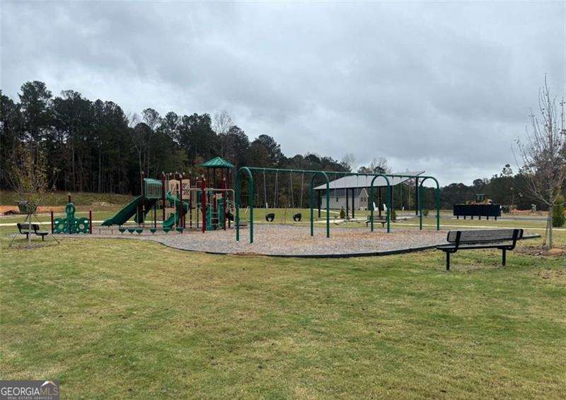 7306 Tolar Road South Fulton, GA 30213 - Photo 3 of 4 a view of a swimming pool and a bench