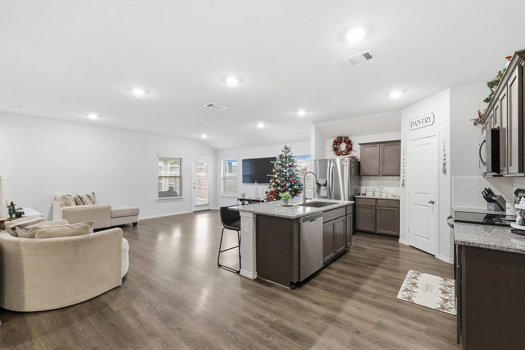 2416 Wildhaven Road Crandall, TX 75114 - Photo 32 of 35 a large room with kitchen island stainless steel appliances lots of counter space