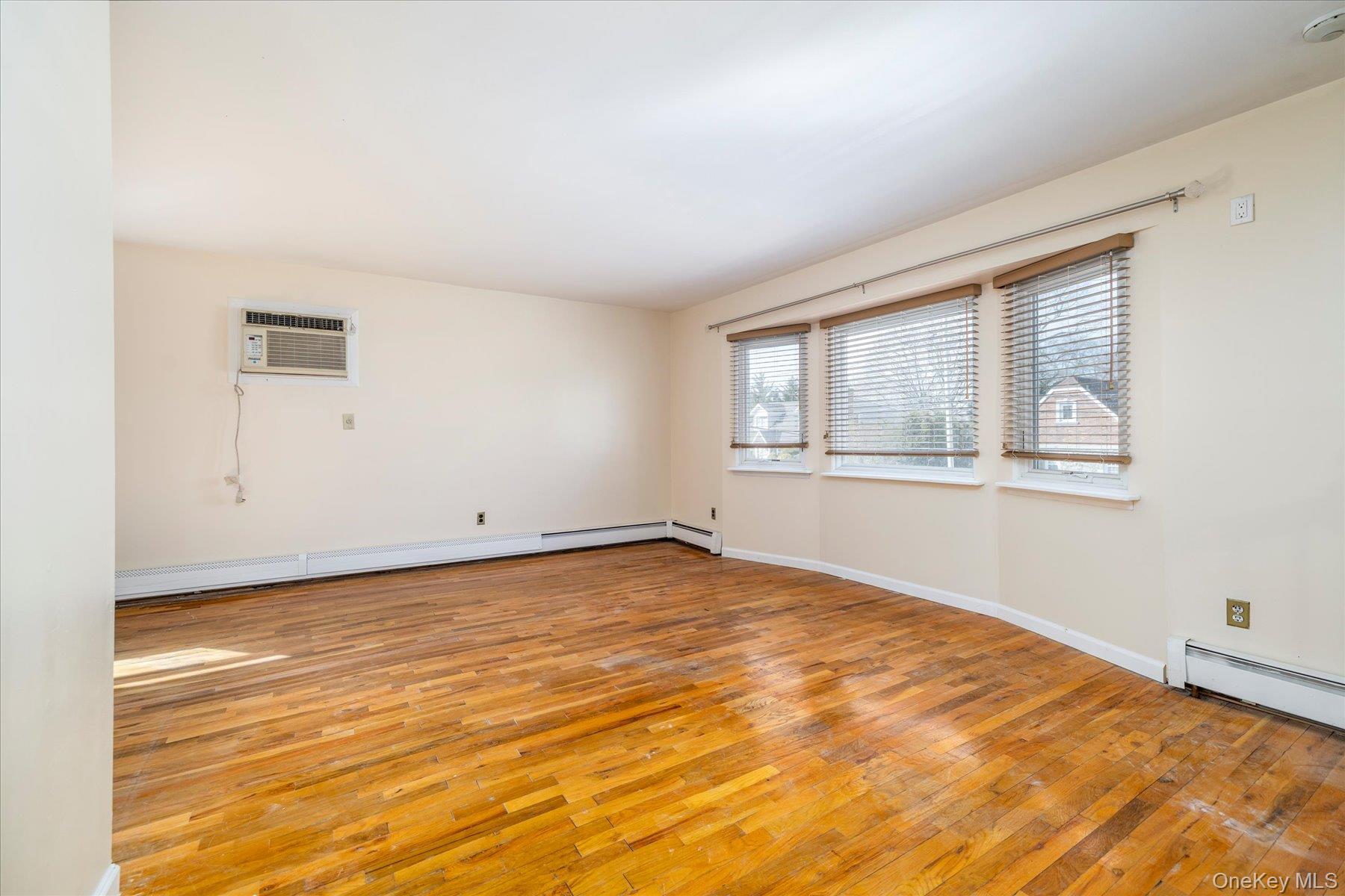 112 Chestnut Street Lynbrook, NY 11563 - Photo 11 of 13 a view of an empty room with a window