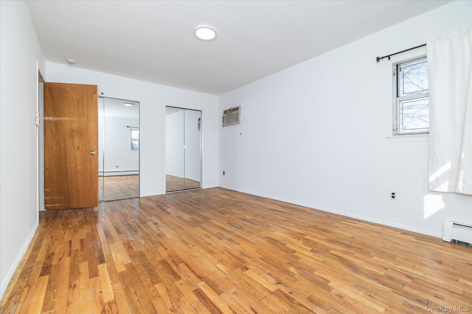 112 Chestnut Street Lynbrook, NY 11563 - Photo 13 of 13 a view of an empty room and window