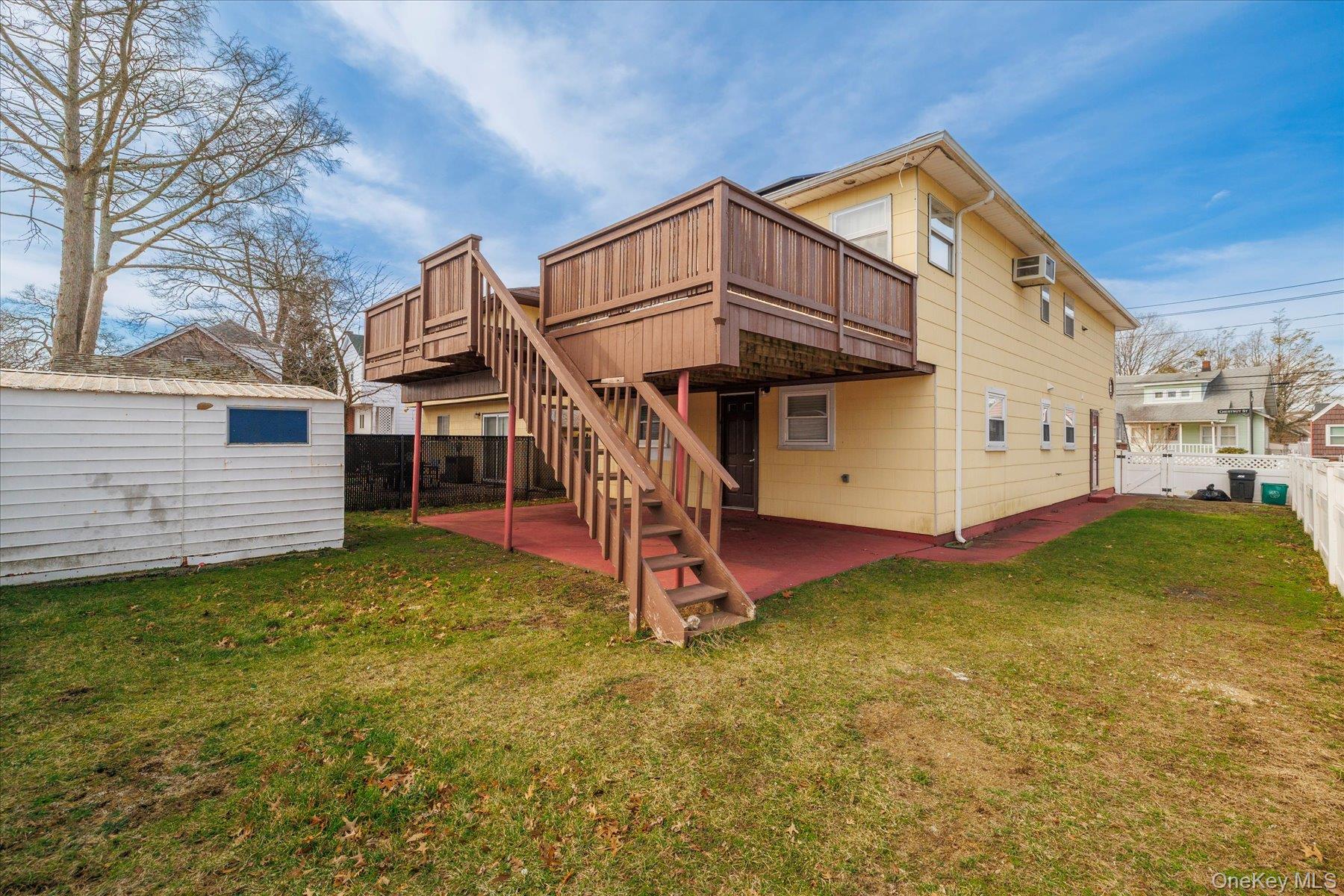 112 Chestnut Street Lynbrook, NY 11563 - Photo 3 of 13 a view of a house with a yard