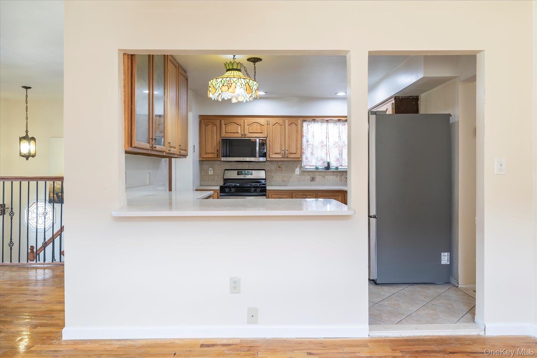 112 Chestnut Street Lynbrook, NY 11563 - Photo 8 of 13 a view of a kitchen from the hallway