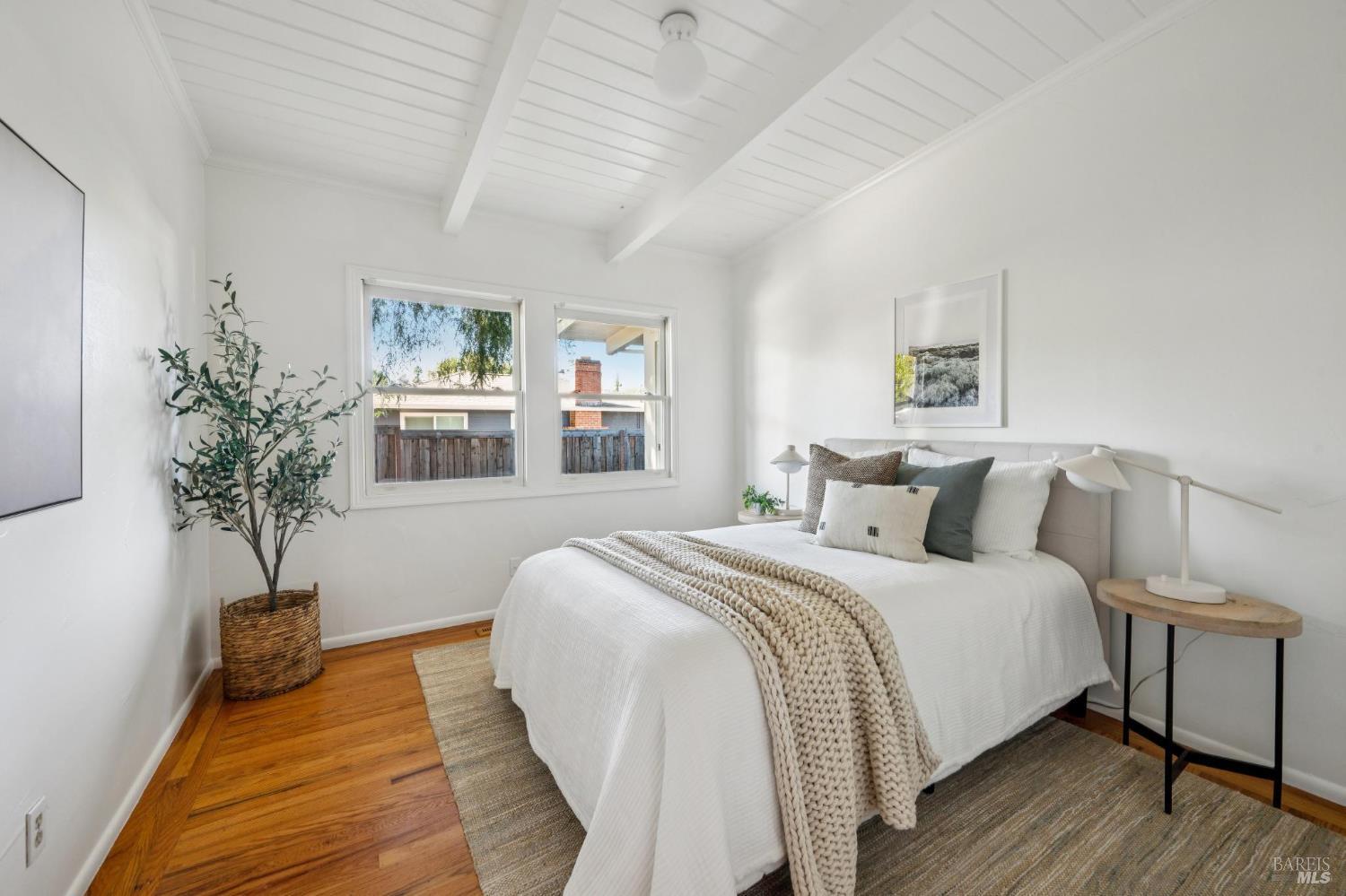 1944 Grosse Avenue Santa Rosa, CA 95404 - Photo 21 of 35 a bedroom with bed and a potted plant
