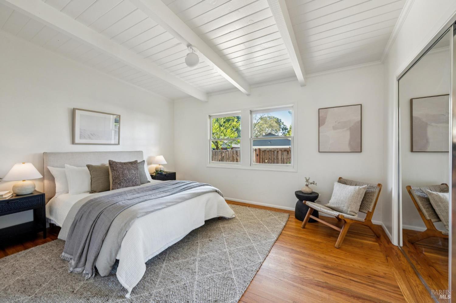 1944 Grosse Avenue Santa Rosa, CA 95404 - Photo 24 of 35 a bedroom with a bed and wooden floor