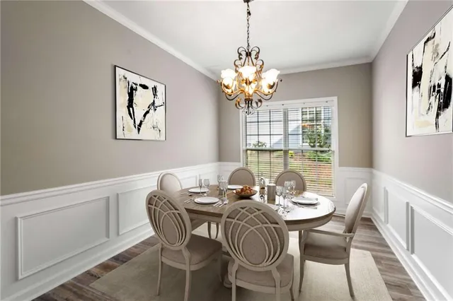 a dining room with furniture a chandelier and wooden floor